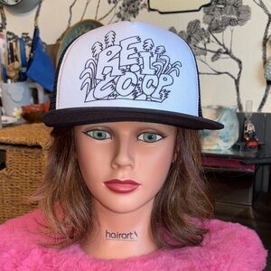 NWOT REI co-op trucker hat, black and white kid drawings in the background of tr